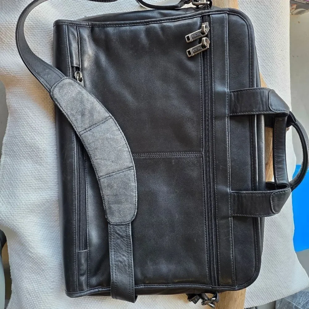 Tumi black leather briefcase